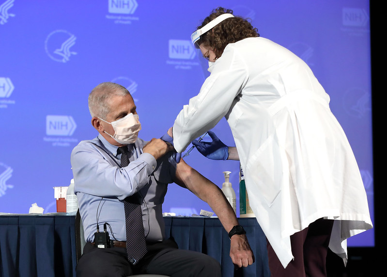 Dr. Anthony Fauci, Director of the National Institute of Allergy and Infectious Diseases, receives the Moderna COVID-19 vaccine at the HHS/NIH COVID-19 Vaccine Kick-Off event at NIH on 12/22/20.