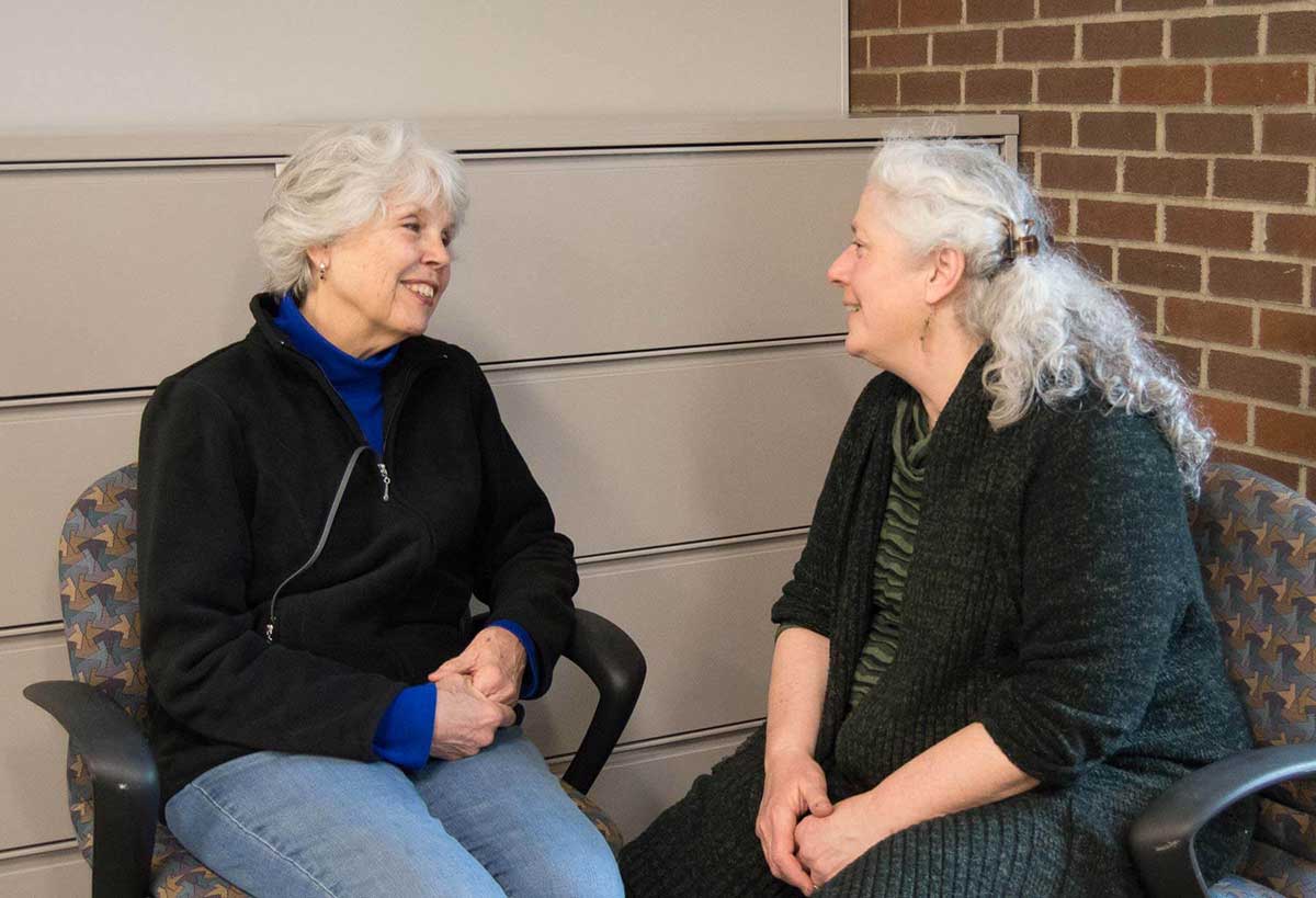 Volunteer Gale Mason talks with Andi Waisman of the Healthy Living program