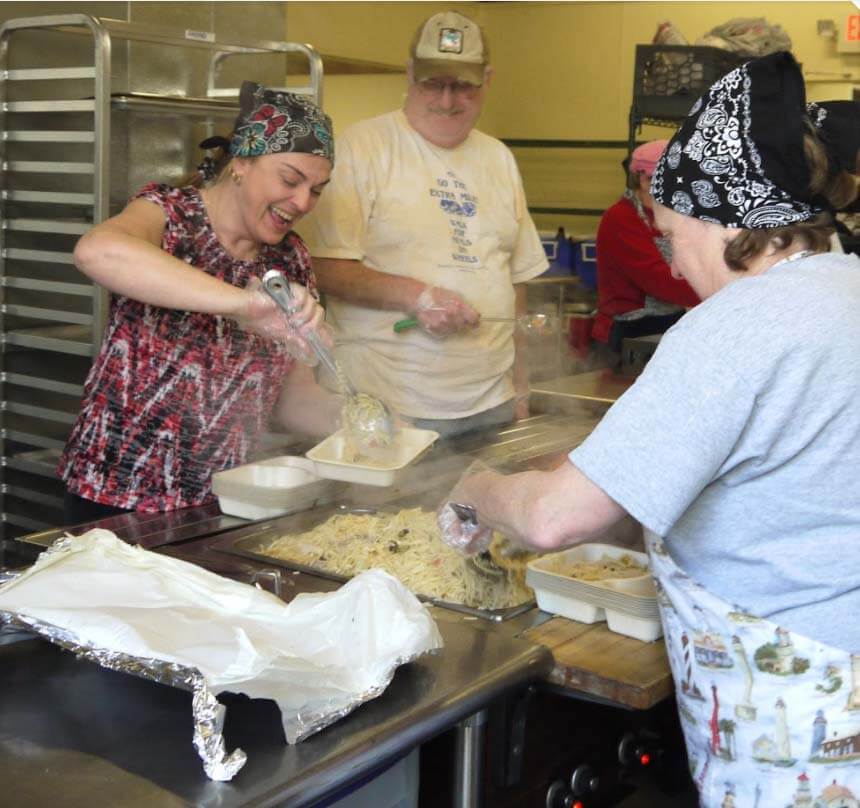 Michael Gilbert, center, taken a few years ago at the kitchen. He's pictured with Ann DeJackome, left, and Betty Mattern, right.