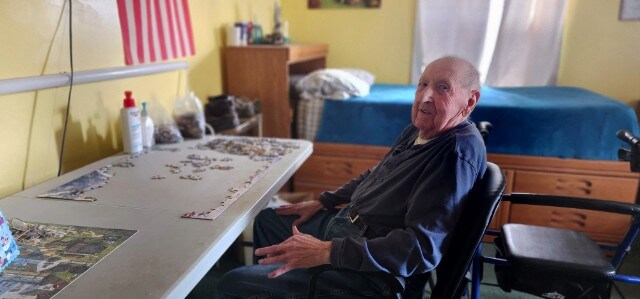 AFC Member Dick Hawthorne, working on a puzzle.