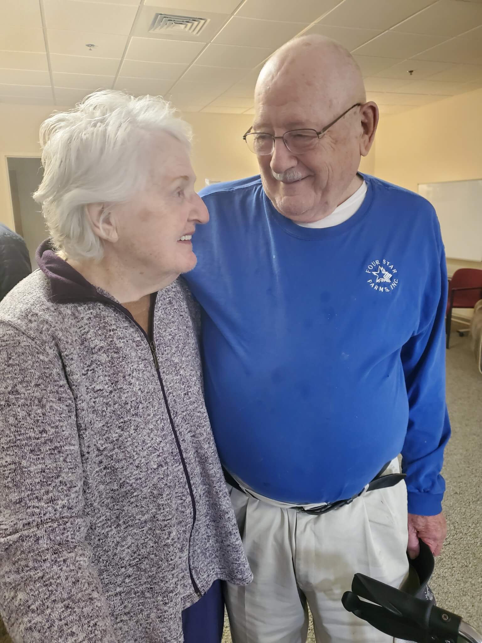 older couple standing outside