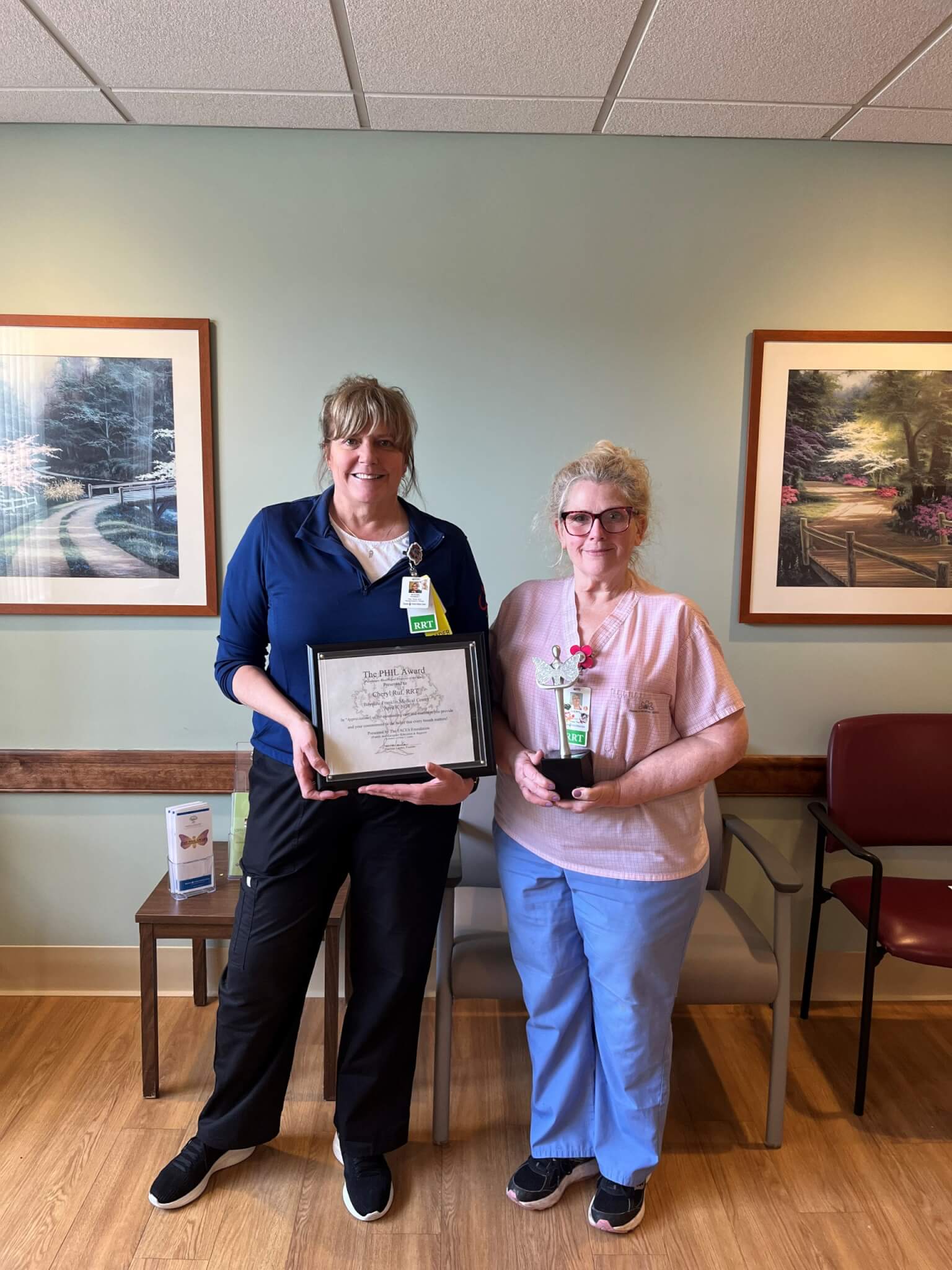 Pictured L-R: Bonnie Robert, RRT Manager, and Cheryl Ruf, RRT, accepting the recent PHIL (Pulmonary Health and Illnesses of the Lung) Award recognizing Cheryl as an Outstanding Respiratory Therapist.