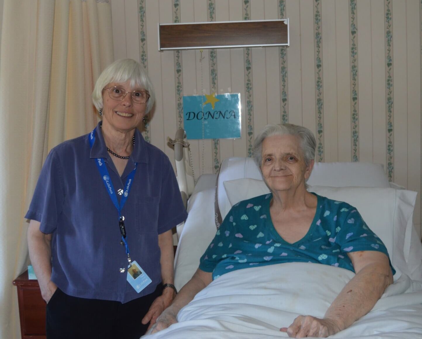 Long-Term Care Ombudsman Volunteer Pam Porter (left) with Resident Council President Donna Thomas (right) at Charlene Manor on May 2, 2024.
