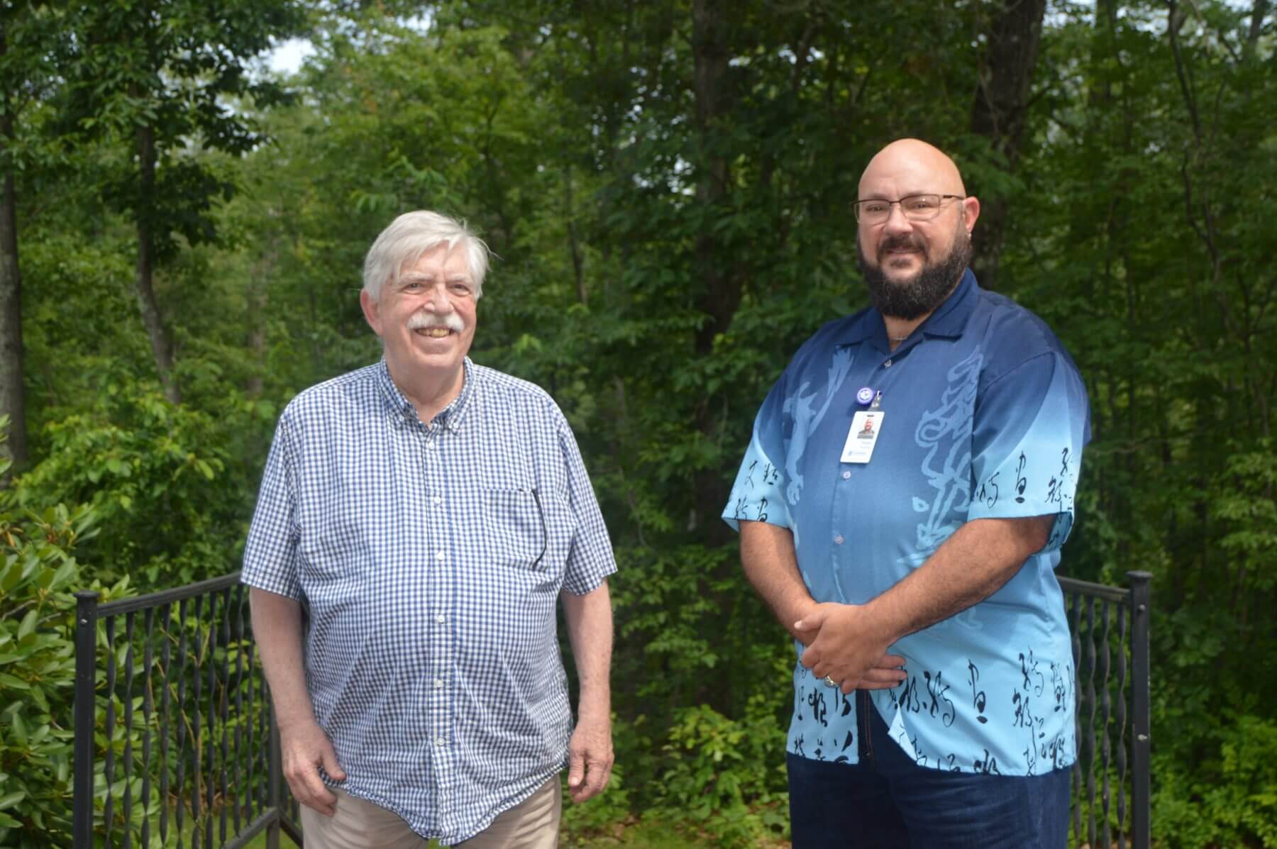 Hugh Knox (left) and Trevor Boeding (right) standing outside.