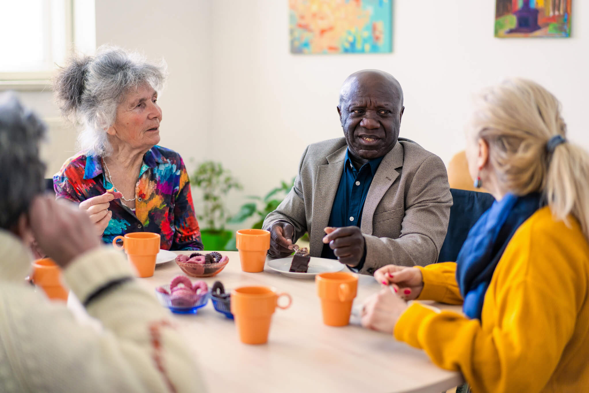 A group of diverse elders at a table.