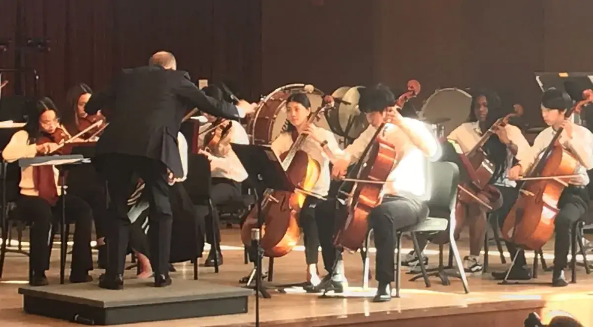 Steven Bathory-Peeler, Northfield Mount Hermon (NMH) Orchestra and Band Concert Director, conducting students at their annual benefit concert in support of LifePath.