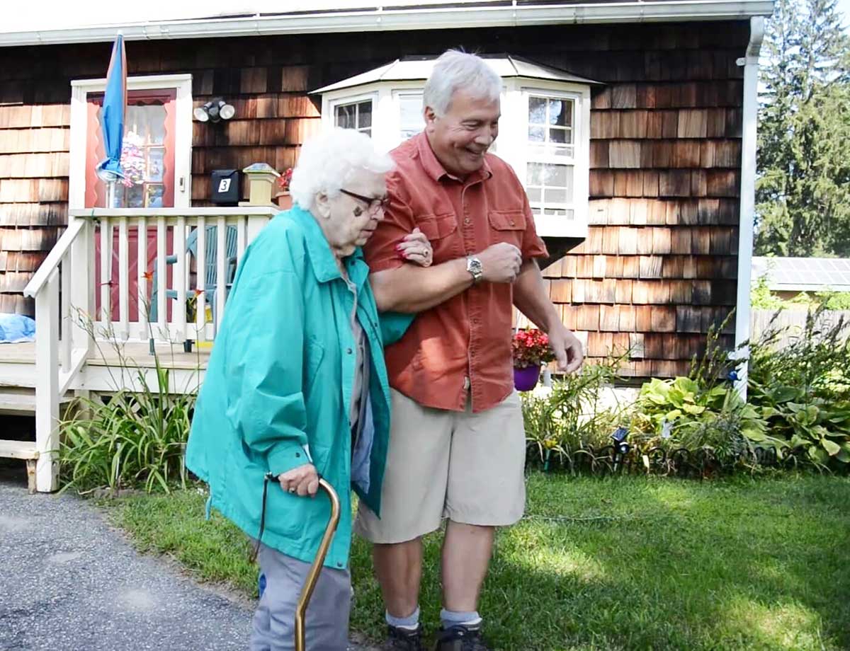 A Rides for Health volunteer assists a client