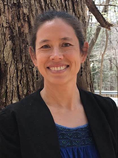 Bi-sek Hsiao smiling in front of a tree