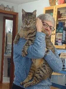 LifePath Volunteer Carol Ball, with her cat Tiger.