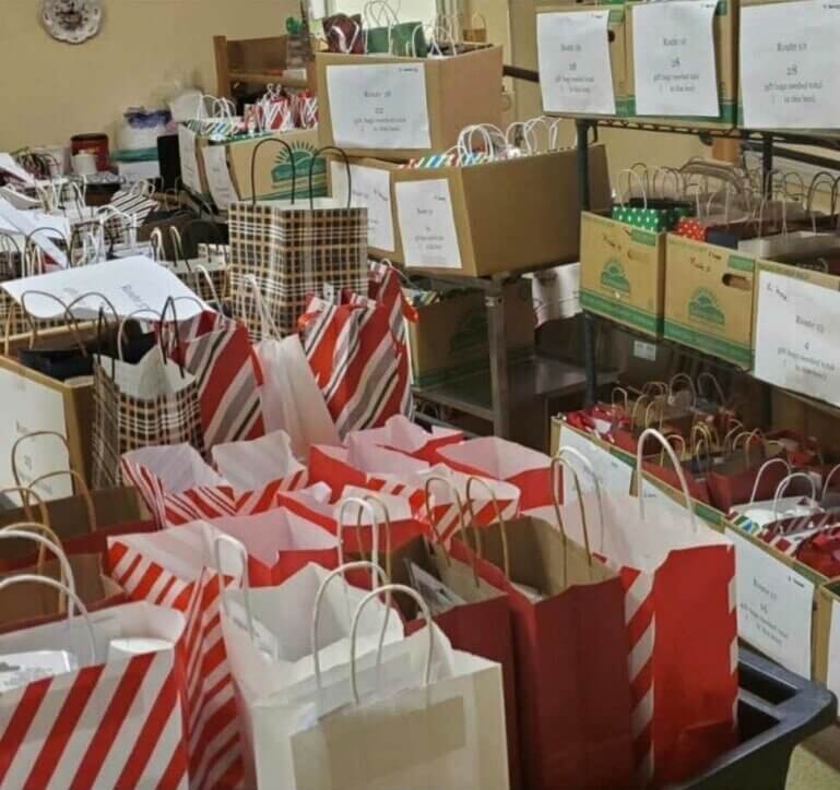 Some of the bags put together by Team Ryan in December 2021, delivered by Meals on Wheels drivers.