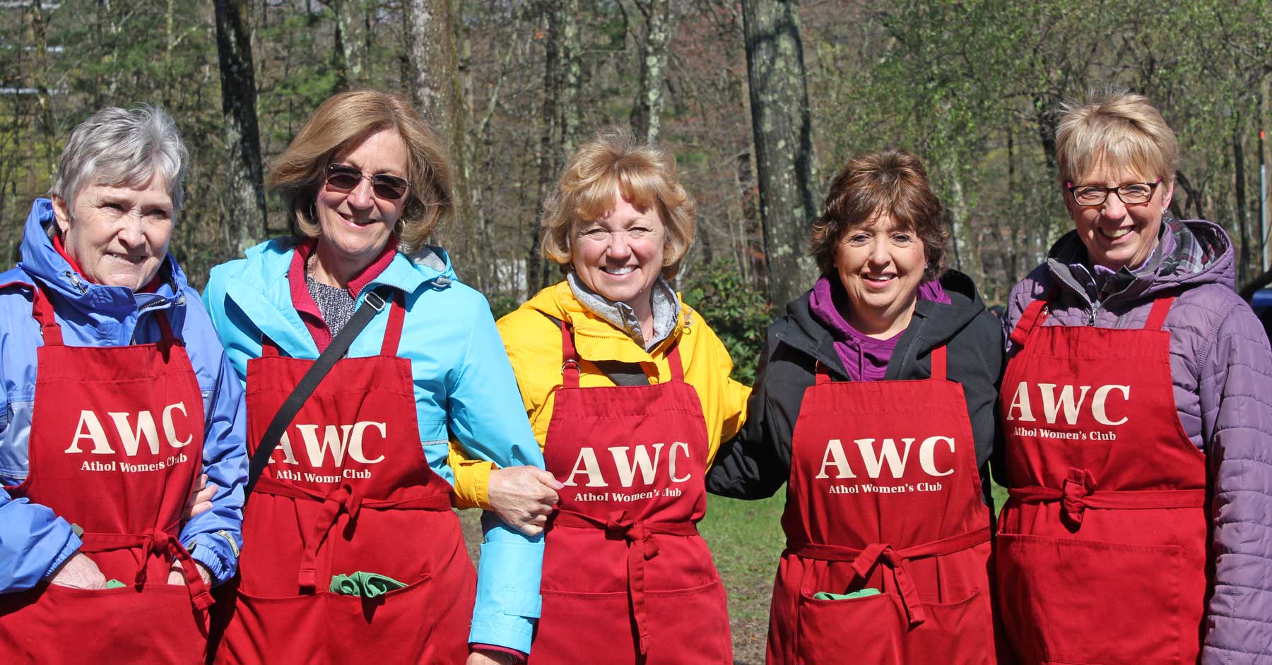 The Athol Women’s Club wearing their red aprons to show their Walkathon team spirit.