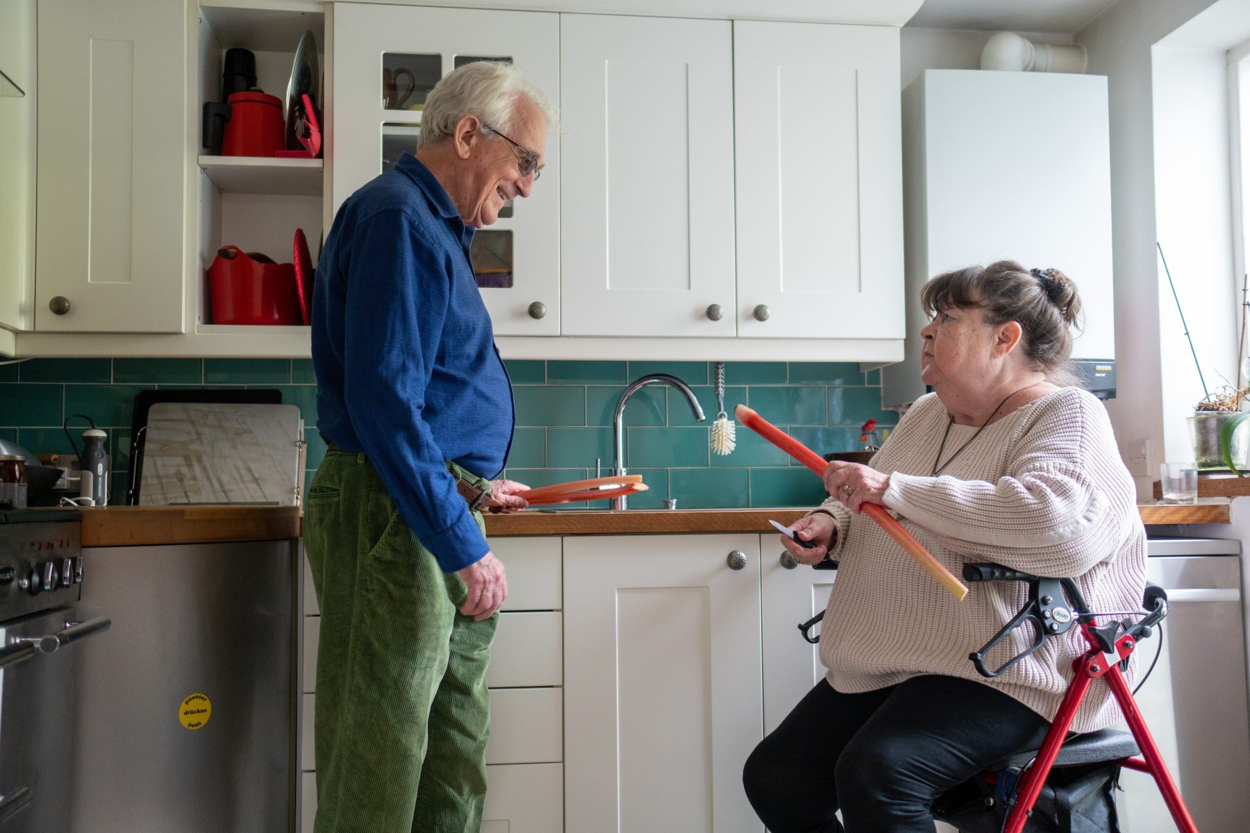 Older couple preparing a meal in the kitchen