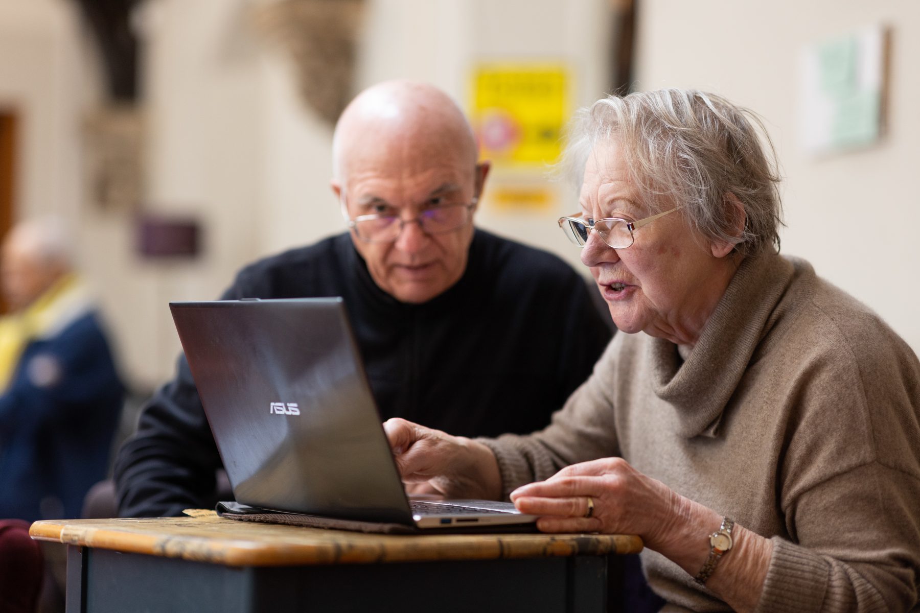 Older couple working together at a computer