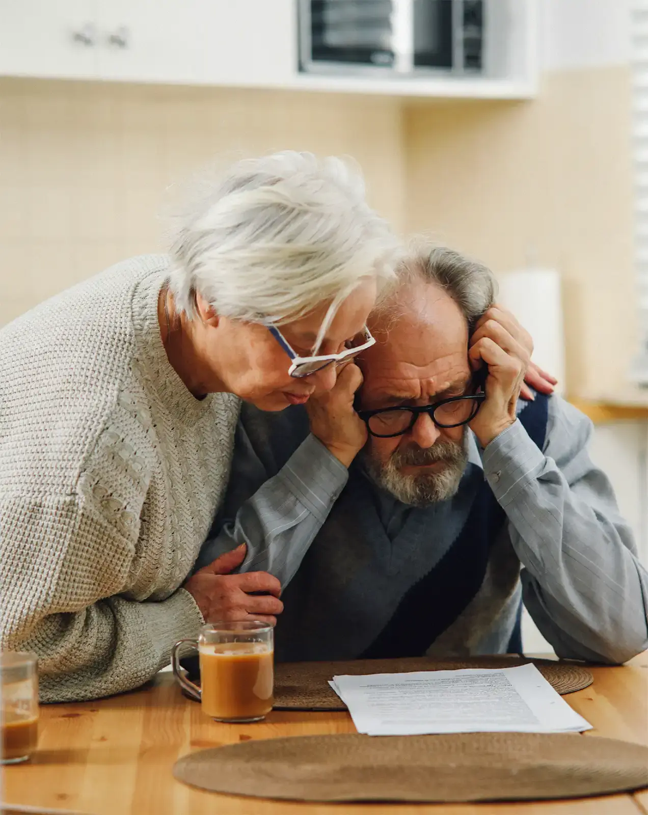 A senior couple worrying over paperwork